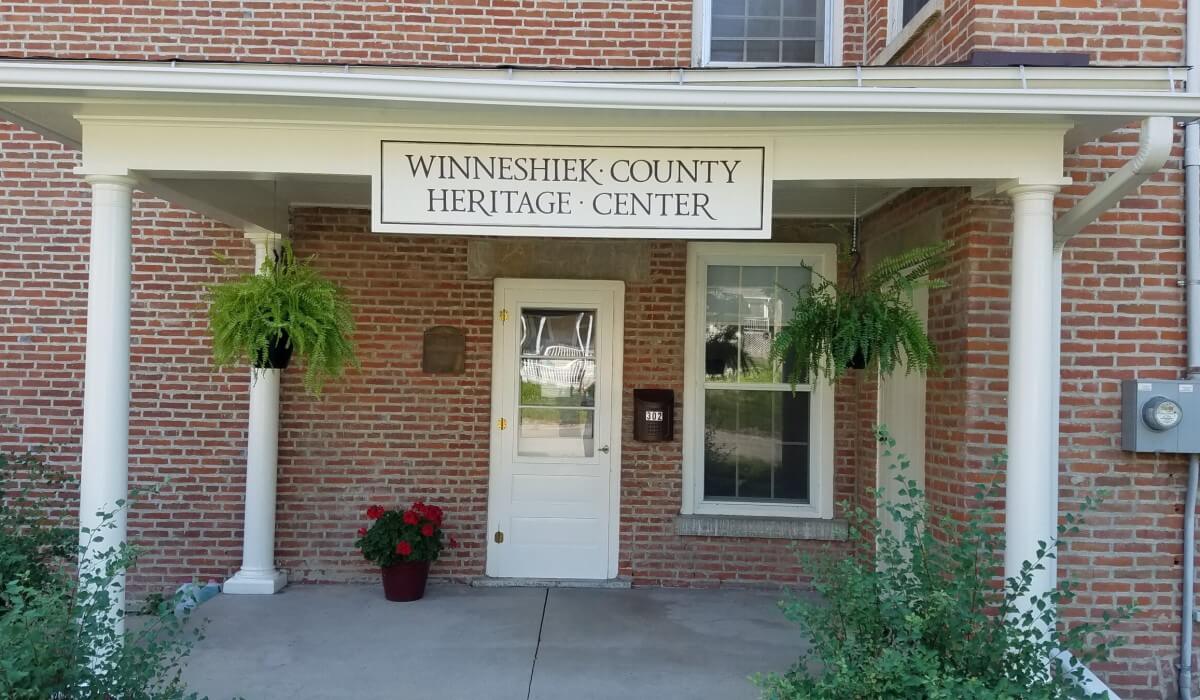 Post Photo for New signage and continuing exterior restoration efforts are visible at the local Historical Society’s Winneshiek County Heritage Center